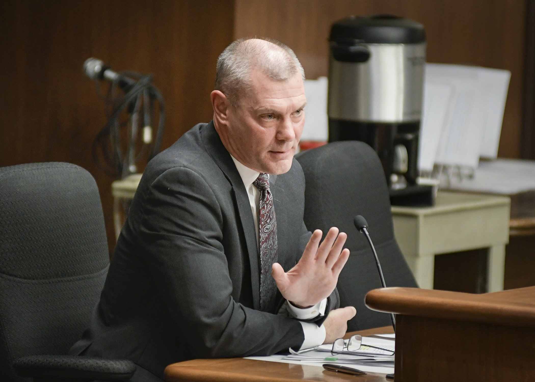 Acting Human Services Commissioner Chuck Johnson testifies March 27 before the House Health and Human Services Finance Committee during discussion of a bill sponsored by Rep. Greg Davids, right, that would modify MNsure operations funding. Photo by Andrew VonBank